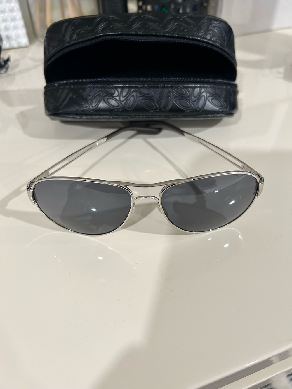 Oakley polarized Sleek Silver Frame Sunglasses with Dark Gray Lenses